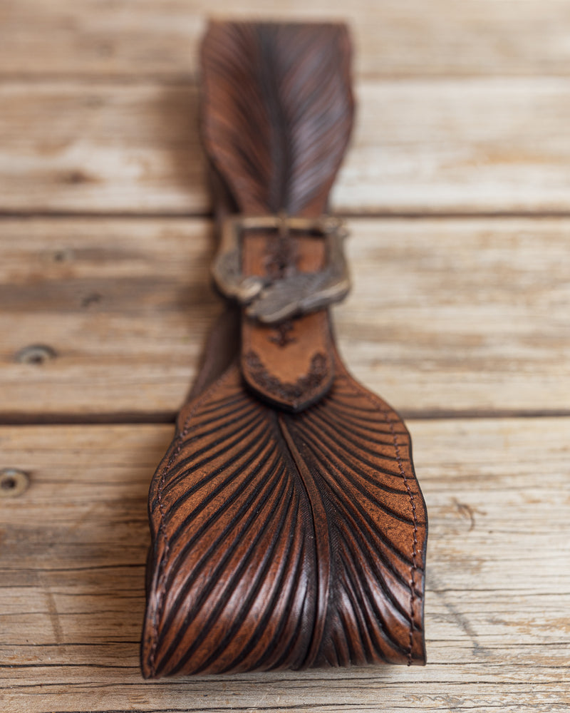 close_up_feather_carving_on_leather_belt